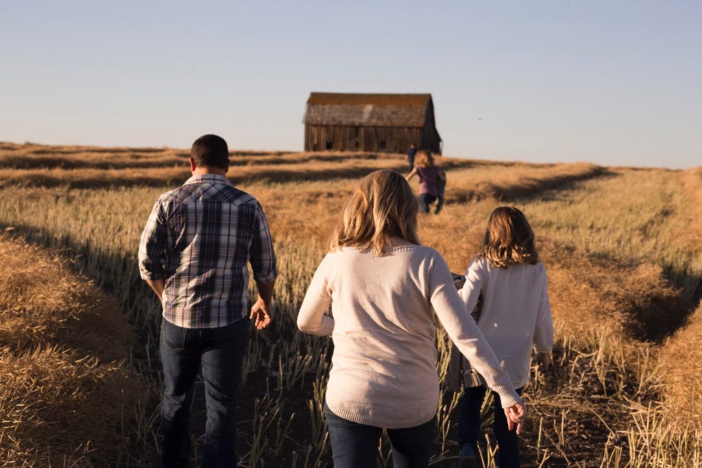 family walking through a field parenting plans