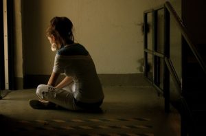 sad woman sitting on the floor spousal support