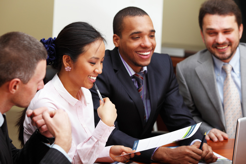 happy professionals having a meeting woman holding a document divorce attorney