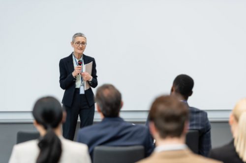 teacher discussing in front of her students divorce mediator