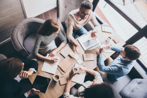 a group of professionals on a meeting room, a man having a discussion with his workmates marriage counseling