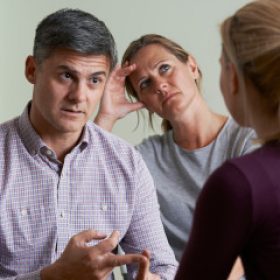 Couple Discussing Problems With Relationship Counsellor